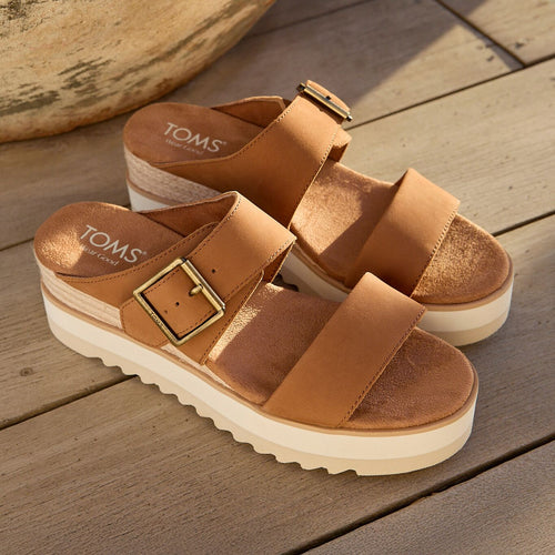 Laydown image of the brown sugar leather Diana buckle wedge sandal