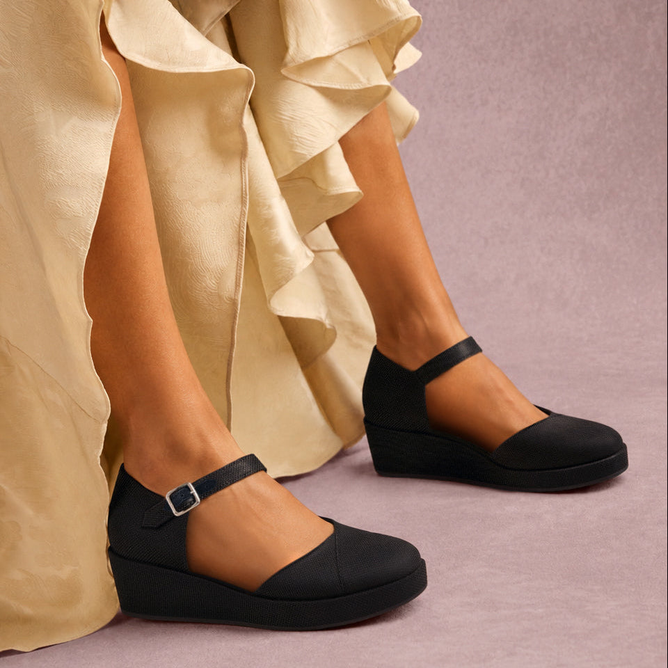 On model image of the black canvas Gwyneth wedge