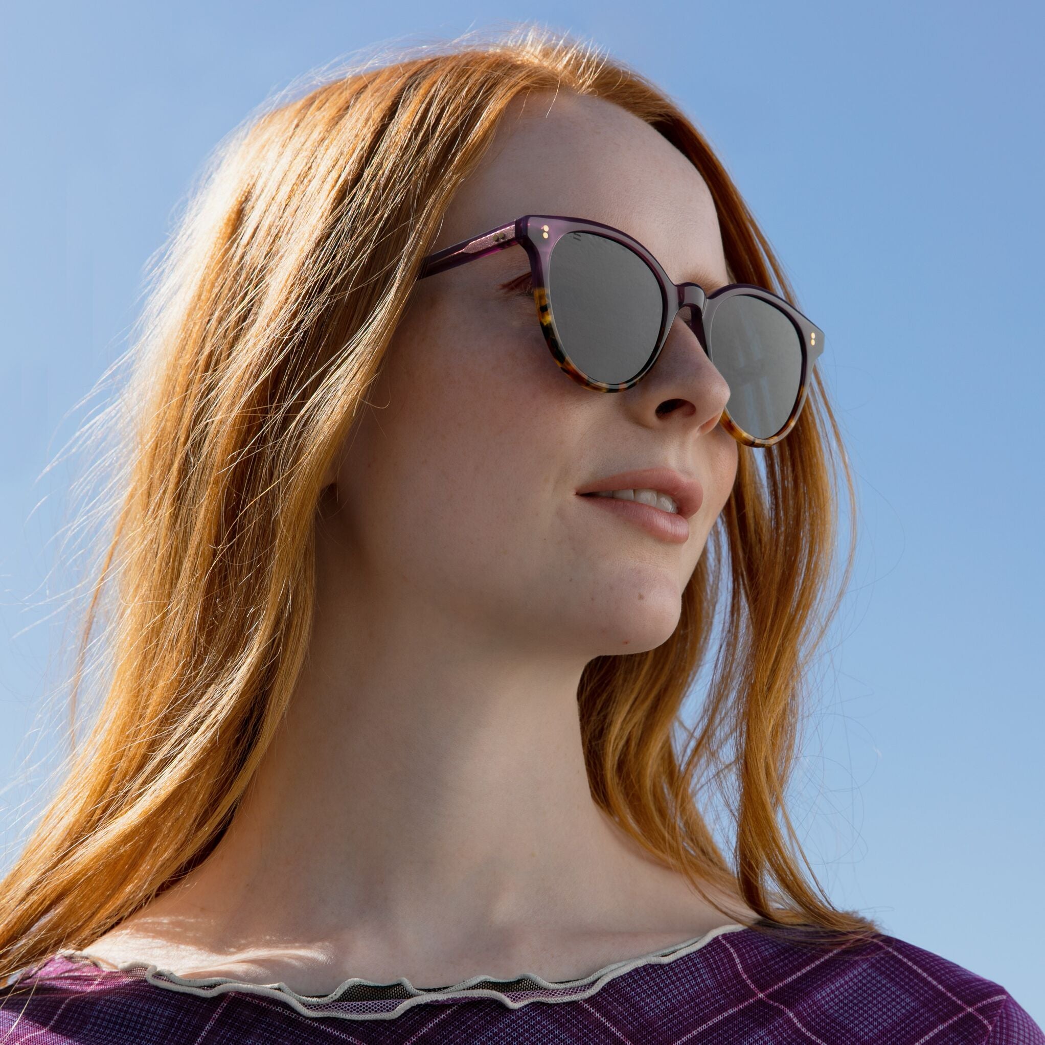 Women's Aaryn Handcrafted Sunglasses Collection model wearing Orchid Tort Colorway