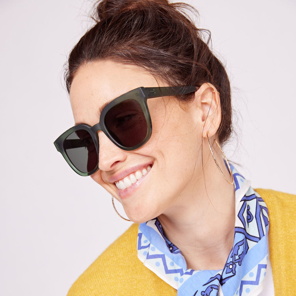 Women's Juniper Traveler Sunglasses in Green Grey Colorway on model image