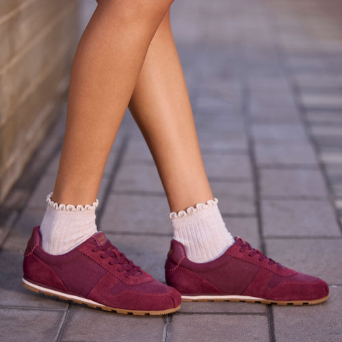 On model image of theWomens TRVL Lite Palisade Sneaker Water Repellent Burgundy Vintage Twill