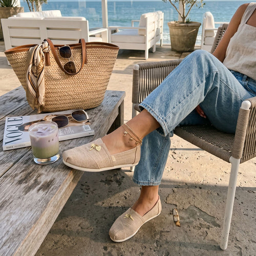 On model mage of the natural undyed heritage canvas women's Alpargata with charm