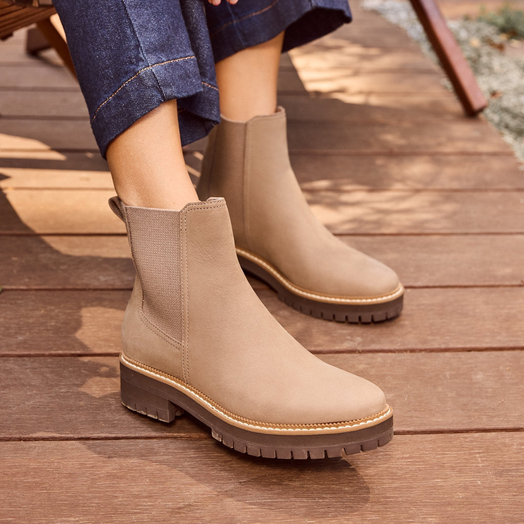 bennet chelsea lug boot on model up close detail shot in dune water resistant nubuck leather