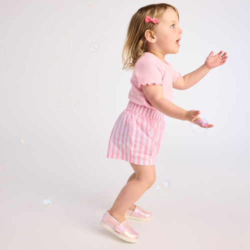 On figure image of the Alpargata Classic TPR Pink Quartz Iridescent Twill Toddler Shoe