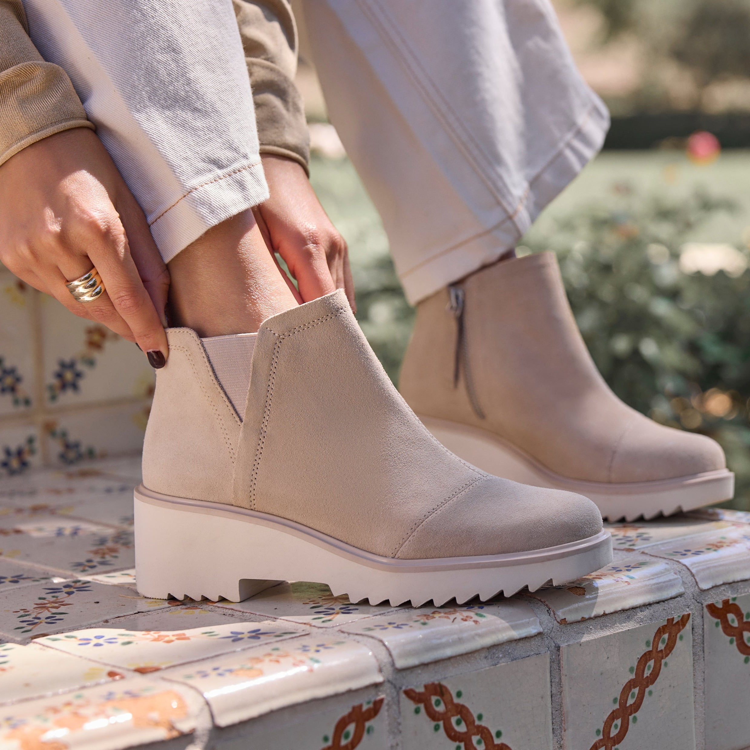 On figure image of the Oatmeal Suede Maude wedge boot