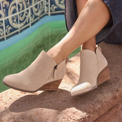 On figure image of the Oatmeal Suede Goldie wedge boot