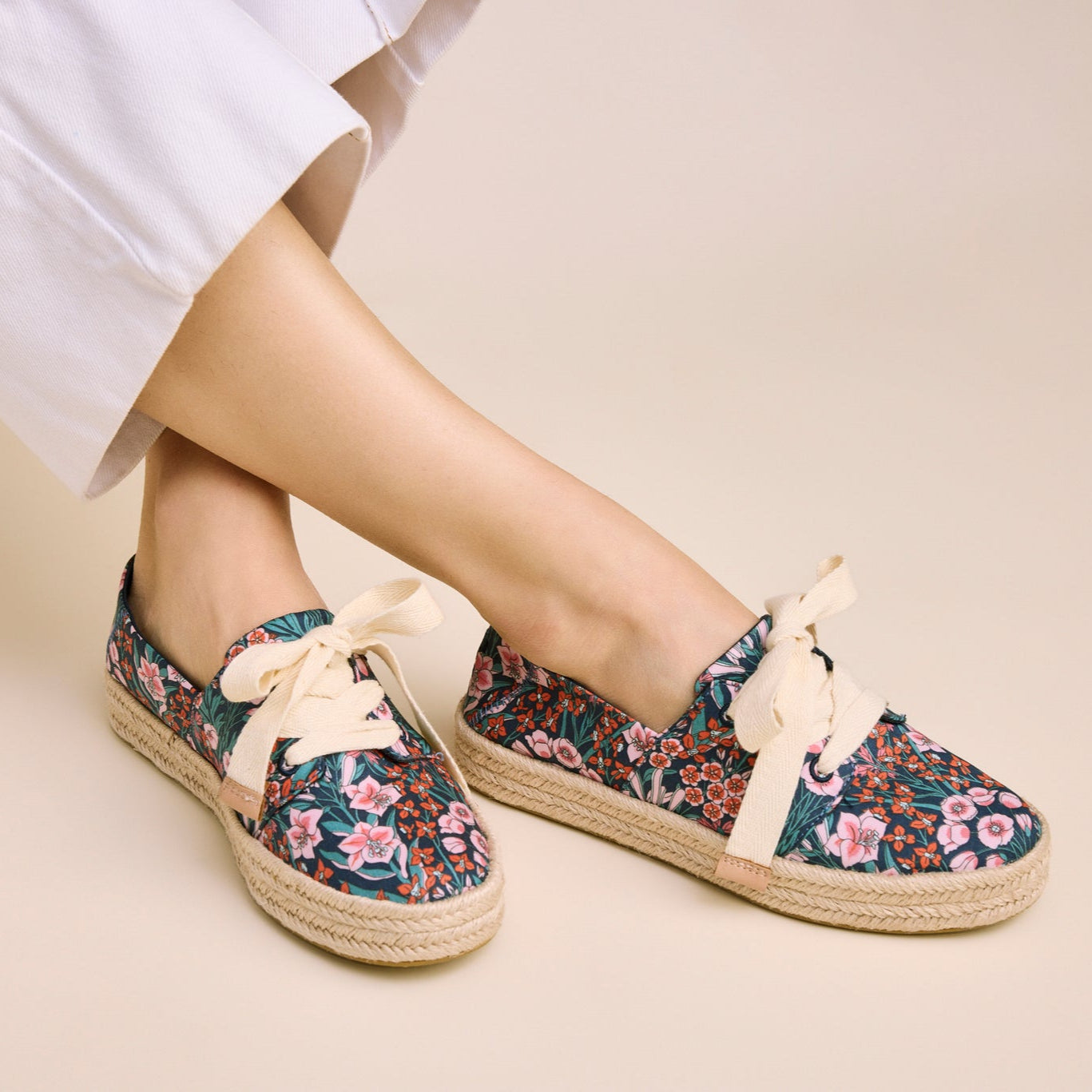 On figure image of the dark teal mountain primrose lace up Carolina espadrilles