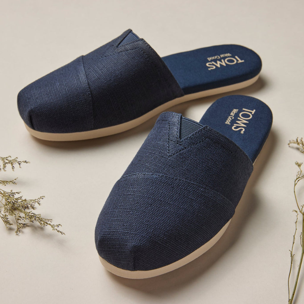 Laydown lifestyle image of the navy heritage canvas Alpargata Mule