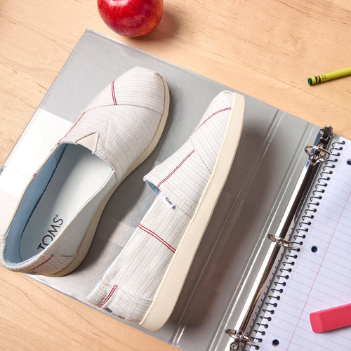 Laydown detail shot of the lined paper back to school Alpargata Plus