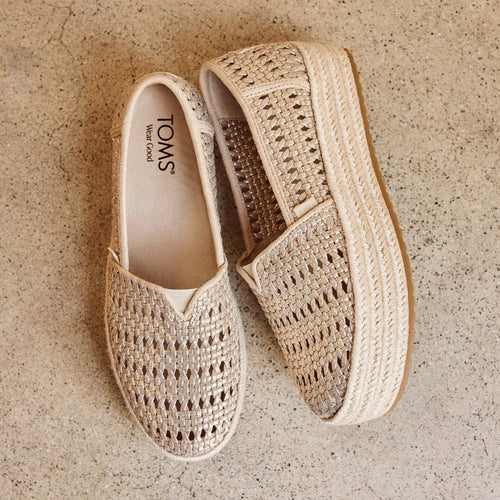 Laydown image of the champagne metallic weave Valencia espadrille for Rocky Barnes campaign