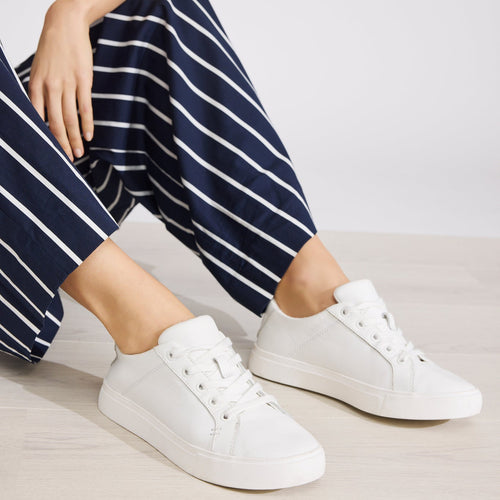 On figure image of the white leather Kameron lace up sneaker