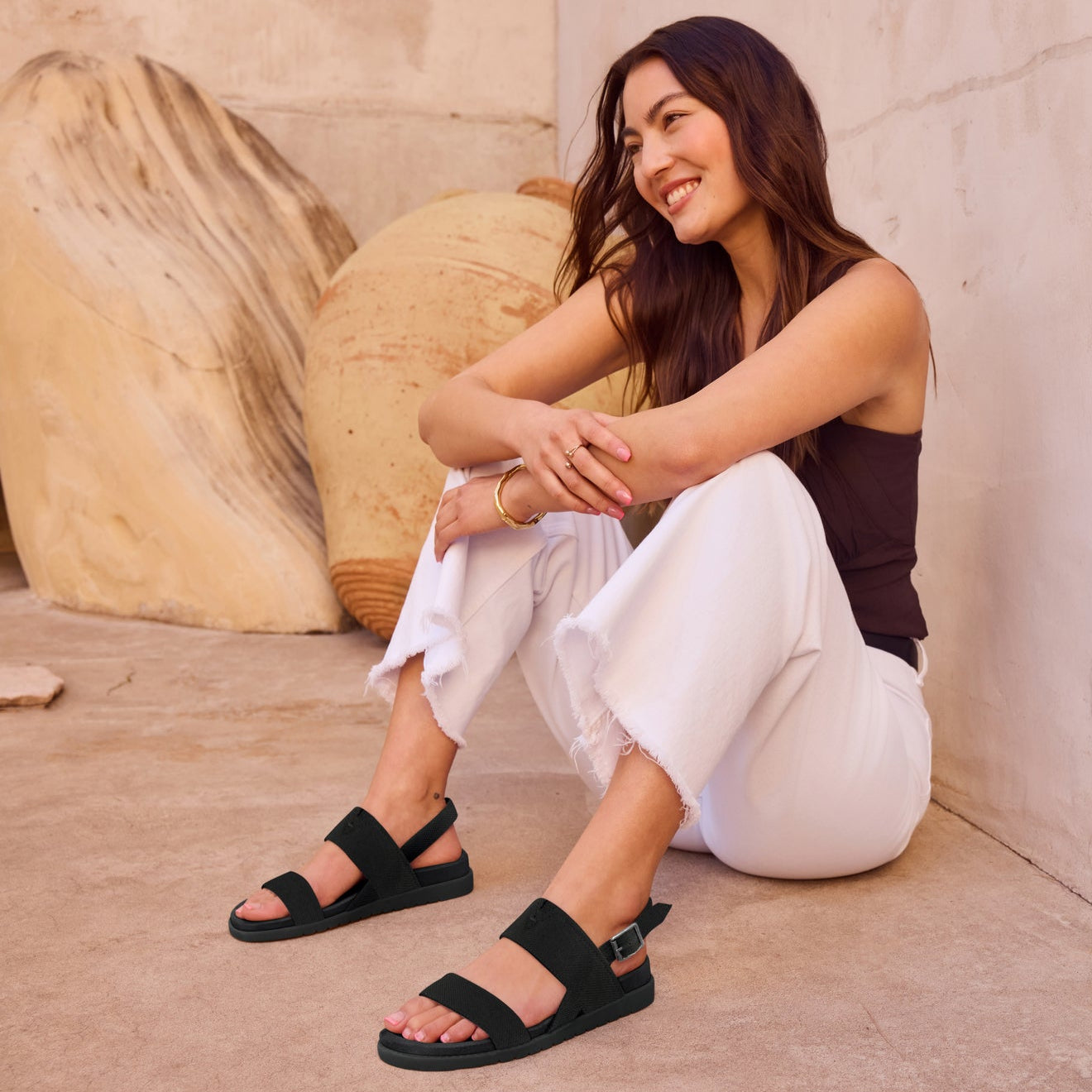 On figure image of the black Marin sandal