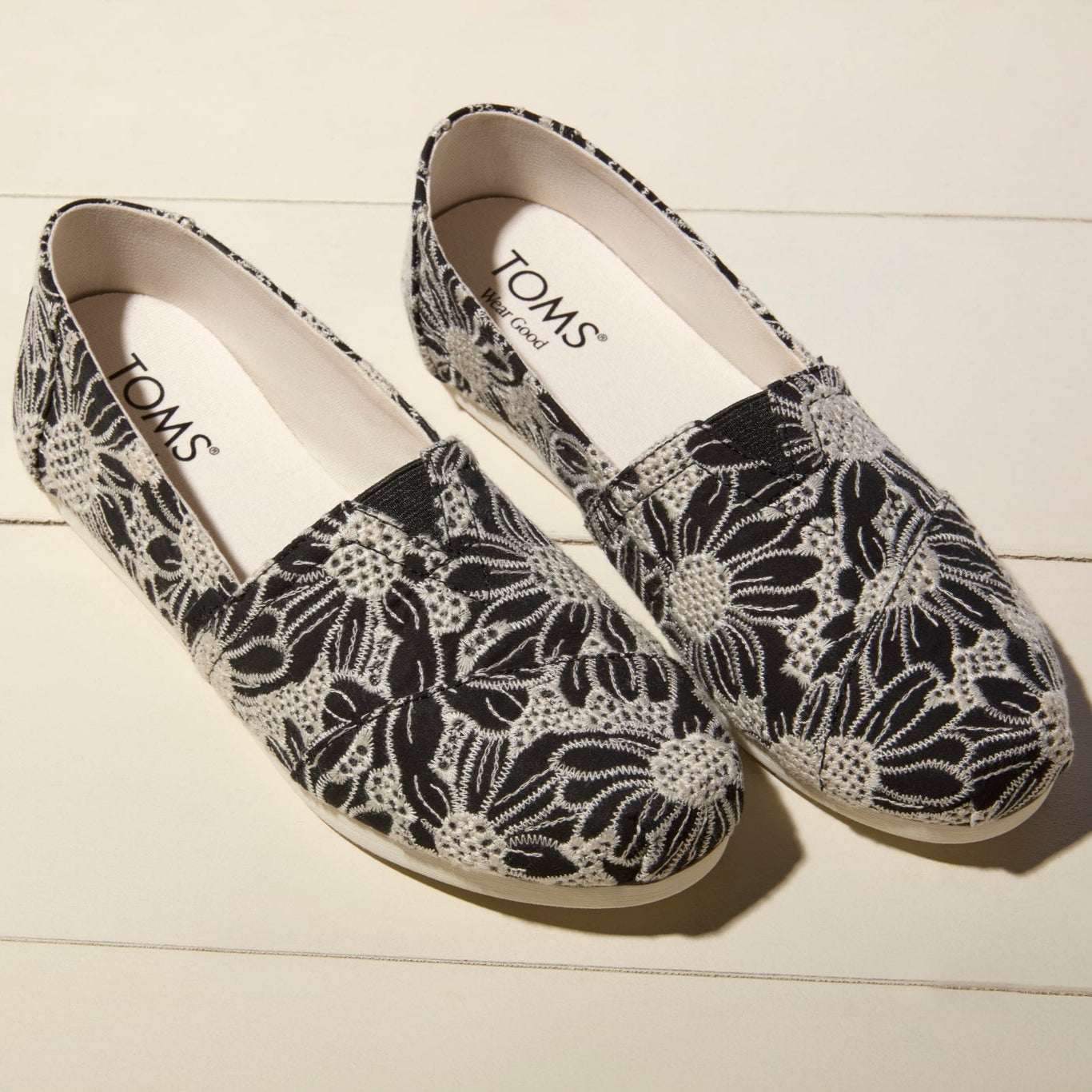 Laydown image of the Black Natural Oversized Floral Eyelet Alpargatas