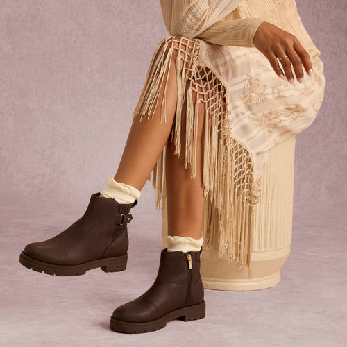 On model image of the Womens Astrid Boot Water Repellent Chocolate Brown Faux Leather