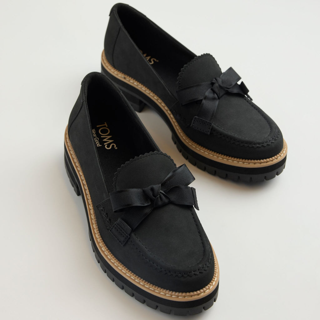 Laydown image of the black Cara bow loafer