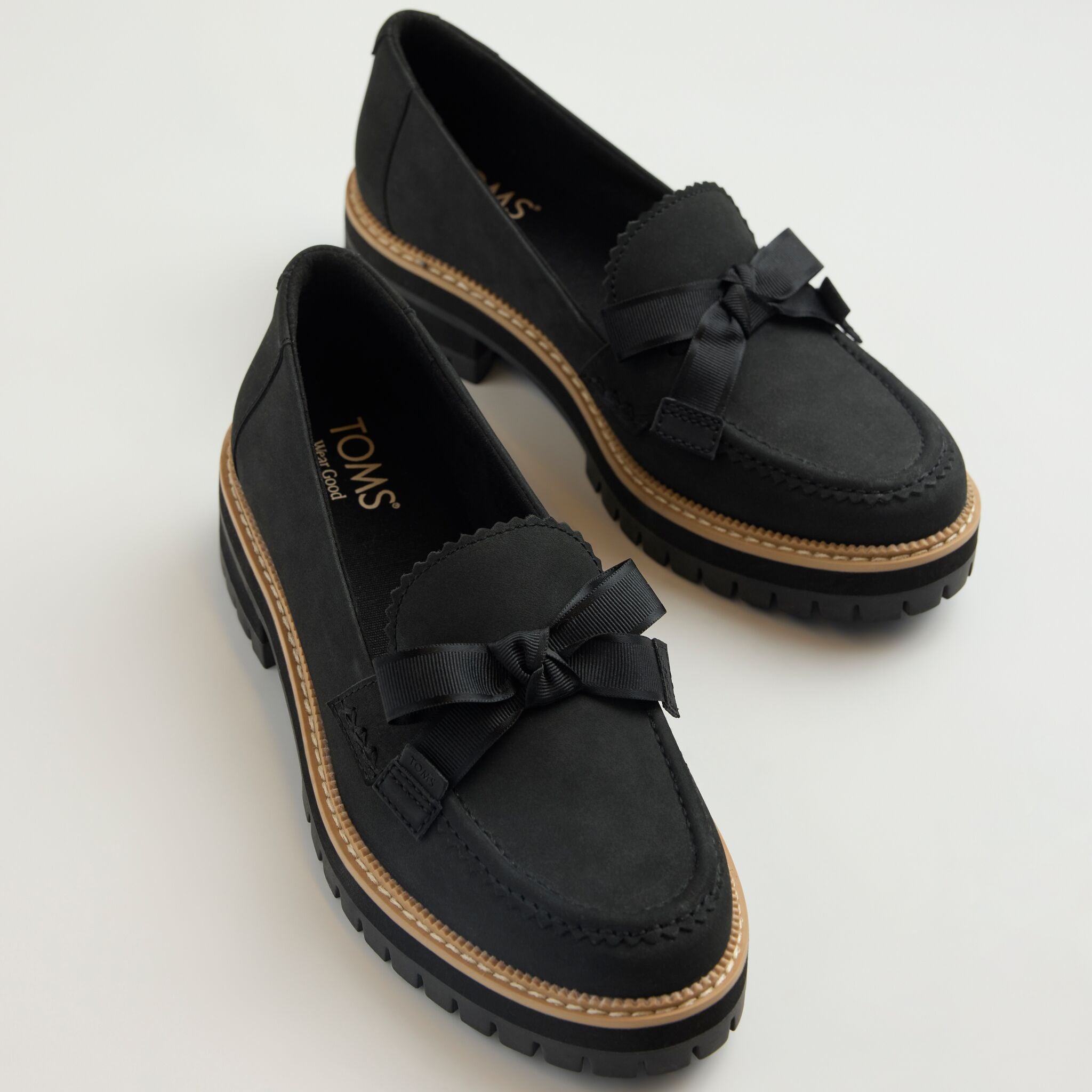 Laydown image of the black Cara bow loafer