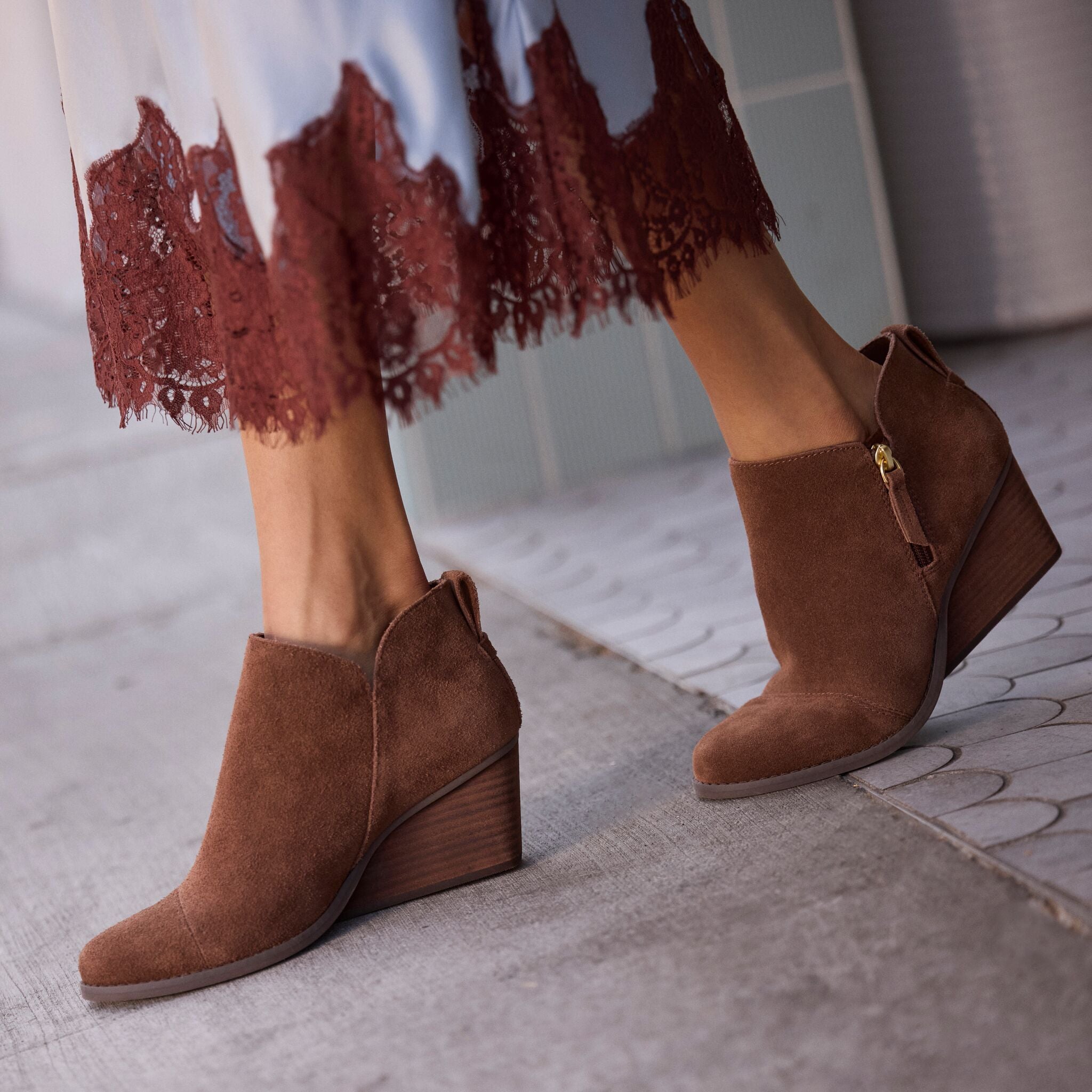 On model image of the Womens Goldie Wedge Ankle Bootie Hot Cocoa Suede
