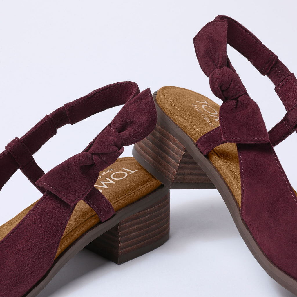 Laydown detail image of the  burgundy suede Jaclyn Slingback heel with bow detail
