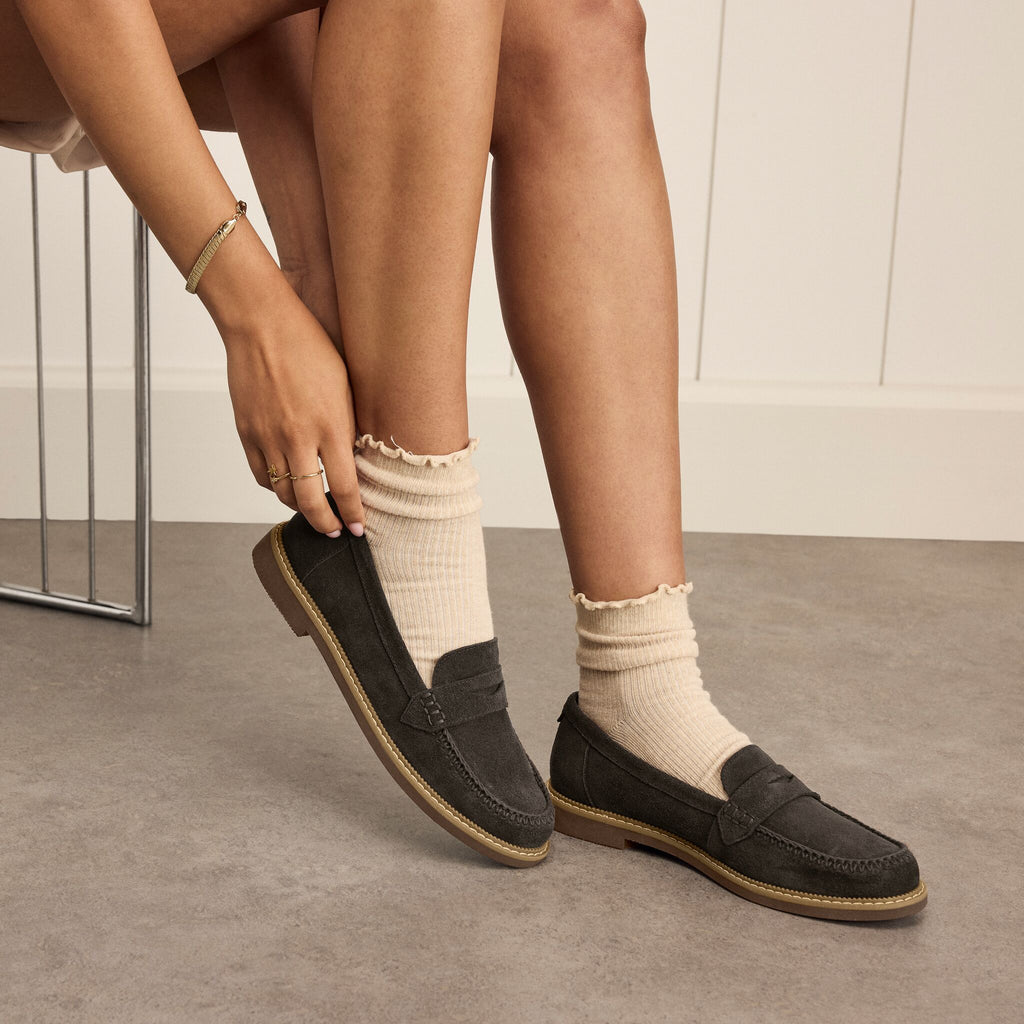 On model image of the the chocolate brown suede Marie loafer