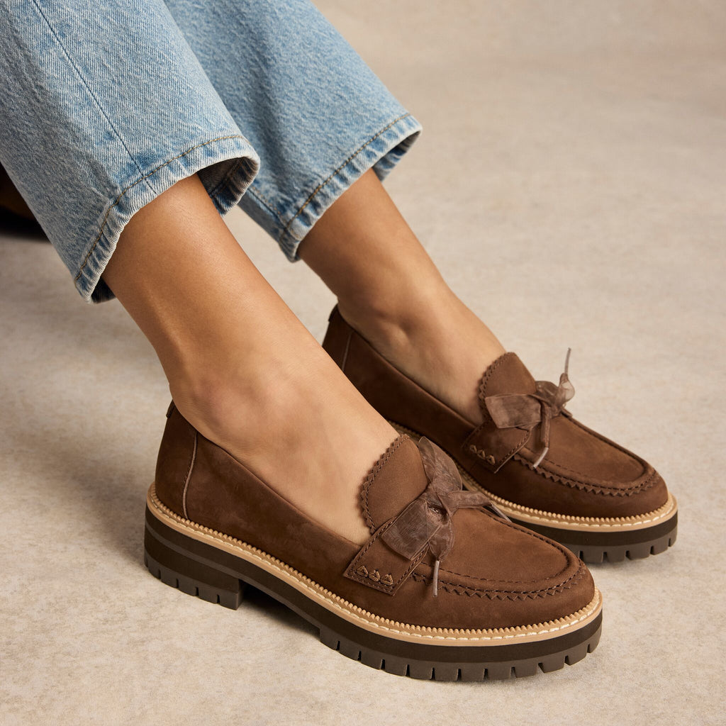 On model image of the brown cocoa Cara bow loafer