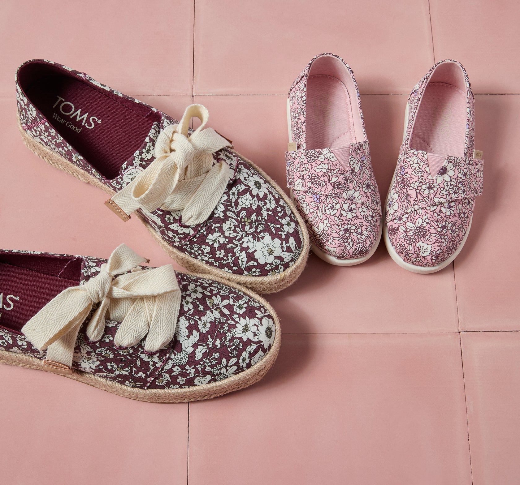 Women's Carolina Lace-Up Espadrille in Burgundy Floral Print & Alpargata Classic Toddler Shoe in Pink Quartz Floral shown.