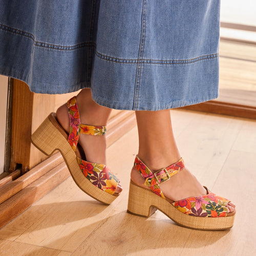 On model image of the tropical floral printed Isla Peep Toe Raffia Heel