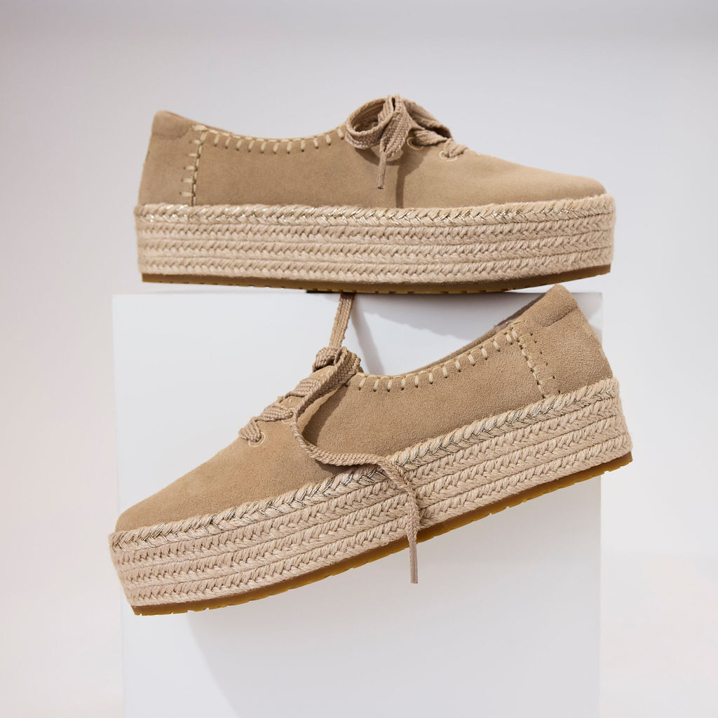 Laydown detail image of the taupe suede Valencia lace up espadrille