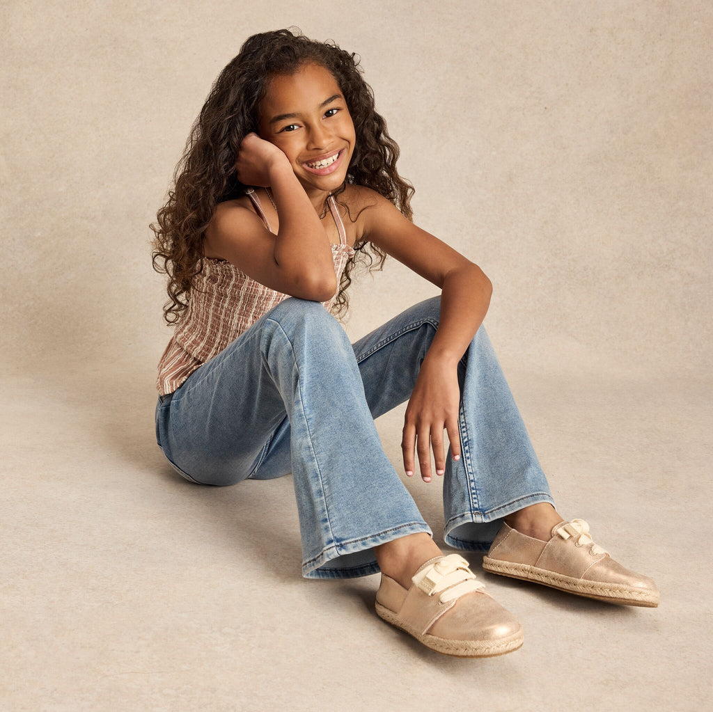 On model image of the metallic seashell youth Carolina lace up espadrille