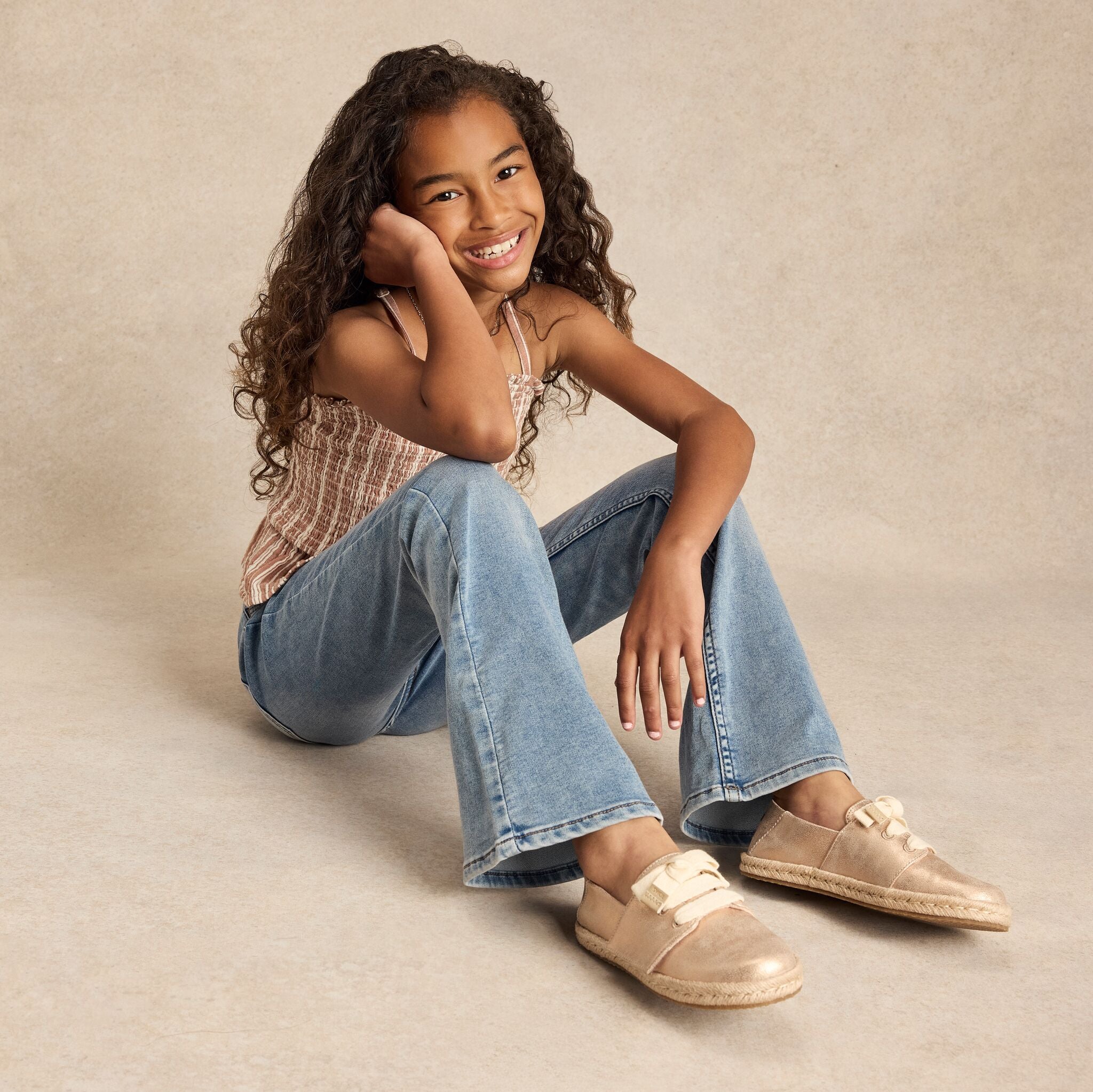 On model image of the metallic seashell youth Carolina lace up espadrille